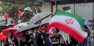Iranian and Palestinian flags at a solidarity rally in Tāmaki Makaurau Auckland today