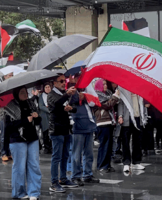 Iranian and Palestinian flags at a solidarity rally in Tāmaki Makaurau Auckland today