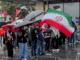 Iranian and Palestinian flags at a solidarity rally in Tāmaki Makaurau Auckland today