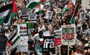 Starving Gaza civilians toll climbs at Israeli humanitarian ‘death traps’ Protesters shout slogans and hold placards during a national demonstration against the Israeli wars on Gaza, occupied Palestine and Iran