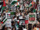 Protesters shout slogans and hold placards during a national demonstration against the Israeli wars on Gaza, occupied Palestine and Iran