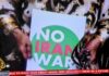 A "No Iran War" placard as protests across Iran and around the world condemn Israeli and US aggression