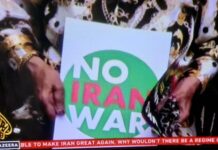 A "No Iran War" placard as protests across Iran and around the world condemn Israeli and US aggression