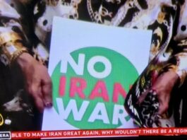 A "No Iran War" placard as protests across Iran and around the world condemn Israeli and US aggression