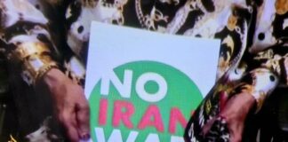 A "No Iran War" placard as protests across Iran and around the world condemn Israeli and US aggression