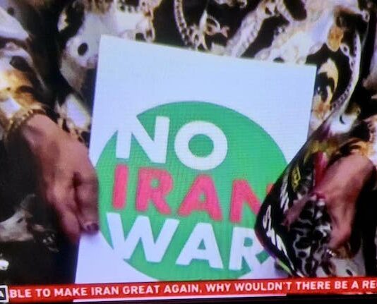A "No Iran War" placard as protests across Iran and around the world condemn Israeli and US aggression