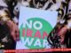 A "No Iran War" placard as protests across Iran and around the world condemn Israeli and US aggression