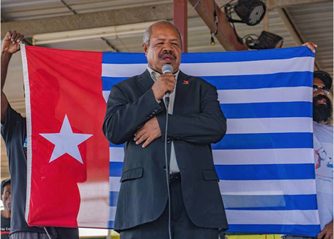 Powes Parkop WP APR 6890wide NCD Governor Powes Parkop with a West Papua flag