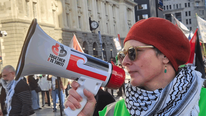 NZ Greens call on state to condemn US over ‘dangerous’ attack on Iran A protester at the Palestine rally against Israel's Gaza genocide and attack on Iran