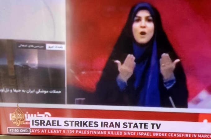 . . . ABut after a brief interruption on screen as debris fell from a bomb strike, Sahar Emami was back presenting the news