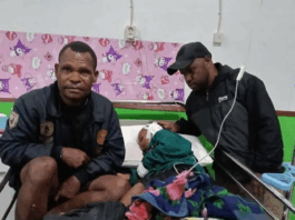 A child victim of the Indonesian military raids in Sugapa district