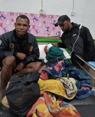 A child victim of the Indonesian military raids in Sugapa district