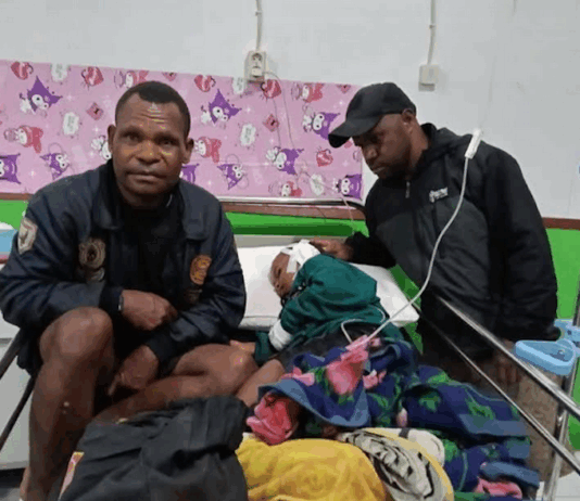 A child victim of the Indonesian military raids in Sugapa district