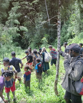 West Papuan villagers fleeing fighting between the Indonesian military and pro-independence militants to Sugapa, the capital of Intan Jaya regency