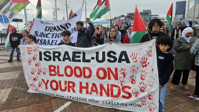 "Israel-USA - blood on your hands" banner at today's rally in Auckland