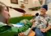 Rainbow Warrior host Niamh O'Flynn talks to author David Robie in the ship's mess as part of the virtual tour