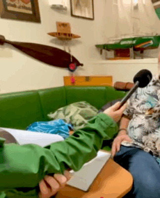 Rainbow Warrior host Niamh O'Flynn talks to author David Robie in the ship's mess as part of the virtual tour