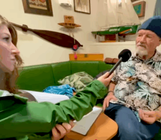 Rainbow Warrior host Niamh O'Flynn talks to author David Robie in the ship's mess as part of the virtual tour