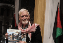 David Robie with his latest book, Eyes of Fire: Last voyage and the Legacy of the Rainbow Warrior