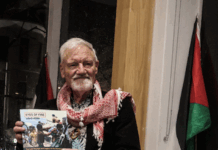 Author David Robie with his latest book, Eyes of Fire: The Last Voyage and Legacy of the Rainbow Warrior.