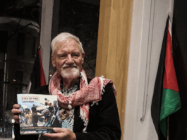 Author David Robie with his latest book, Eyes of Fire: The Last Voyage and Legacy of the Rainbow Warrior.