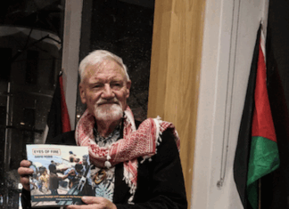 Author David Robie with his latest book, Eyes of Fire: The Last Voyage and Legacy of the Rainbow Warrior.