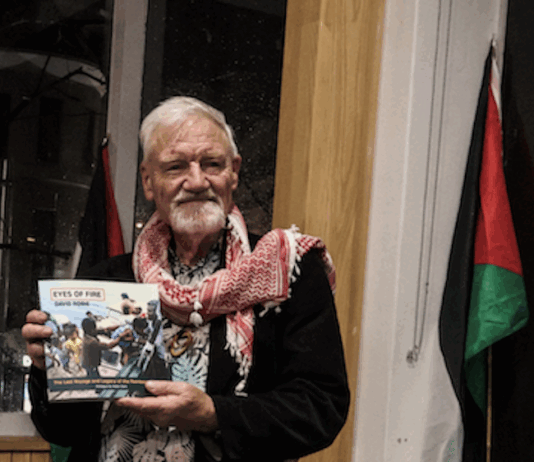 Author David Robie with his latest book, Eyes of Fire: The Last Voyage and Legacy of the Rainbow Warrior.