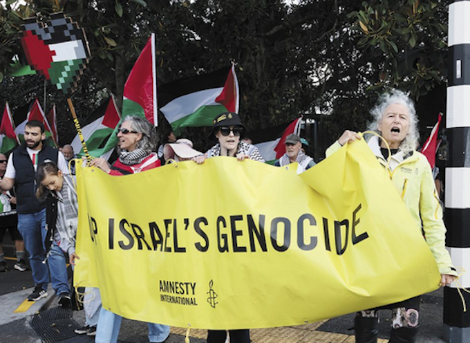 Devonport Protest DF 680wide Public protest in the NZ naval base suburb of Auckland . . . local resident Margaret Taylor of Amnesty International (right) at the front of the Devonport Out For Gaza march on Victoria Rd