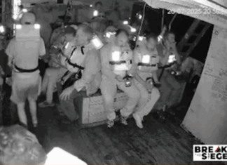 The Freedom Flotilla's Handala crew in emegency positions just before the Israeli military seizure of their humanitarian aid ship on Saturday