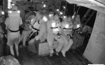 The Freedom Flotilla's Handala crew in emegency positions just before the Israeli military seizure of their humanitarian aid ship on Saturday