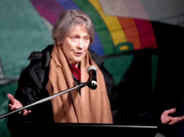 Former NZ prime minister Helen Clark speaking on the deck of the Rainbow Warrior