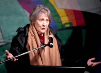 Former NZ prime minister Helen Clark speaking on the deck of the Rainbow Warrior