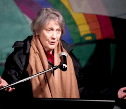 Former NZ prime minister Helen Clark speaking on the deck of the Rainbow Warrior
