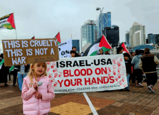 A young girl holds a placard quoting from the late Pope Francis while calling for an end to the war on Gaza in Auckland last Saturday