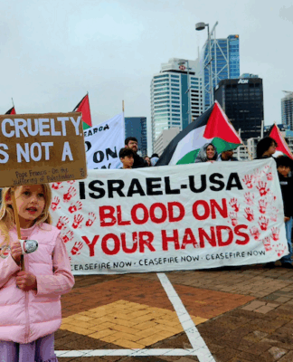 Gaza not a religious issue – it’s a massive violation of international law, say accord critics A young girl holds a placard quoting from the late Pope Francis while calling for an end to the war on Gaza in Auckland last Saturday