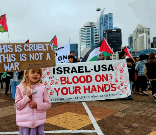 A young girl holds a placard quoting from the late Pope Francis while calling for an end to the war on Gaza in Auckland last Saturday