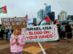 A young girl holds a placard quoting from the late Pope Francis while calling for an end to the war on Gaza in Auckland last Saturday