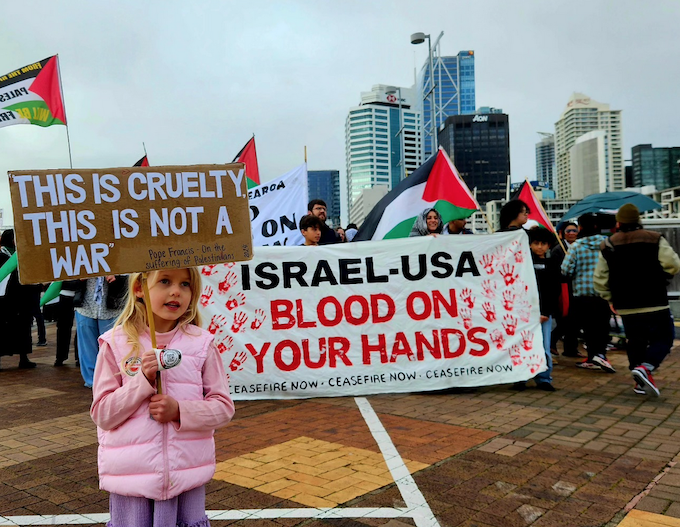 Israel-USA APR 680wide A young girl holds a placard quoting from the late Pope Francis while calling for an end to the war on Gaza in Auckland last Saturday