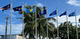 Flags from most of the Micronesian islands participating in the regional summit this week fly outside the International Conference Center
