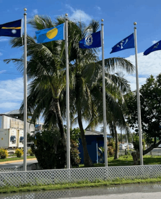 Flags from most of the Micronesian islands participating in the regional summit this week fly outside the International Conference Center
