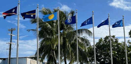 Flags from most of the Micronesian islands participating in the regional summit this week fly outside the International Conference Center