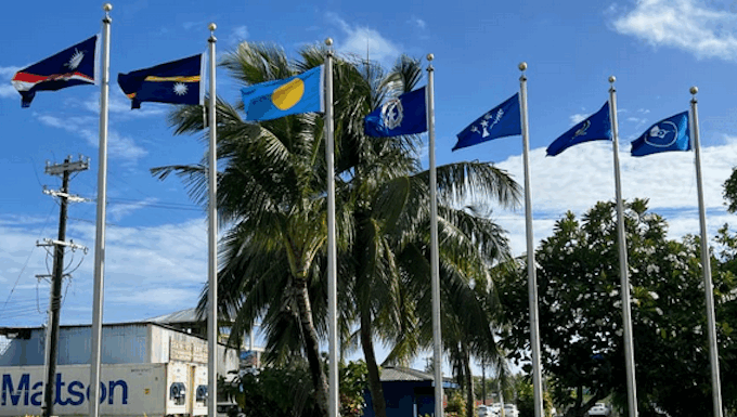 Flags from most of the Micronesian islands participating in the regional summit this week fly outside the International Conference Center