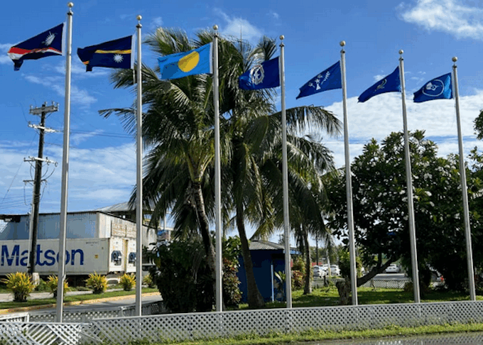Flags from most of the Micronesian islands participating in the regional summit this week fly outside the International Conference Center