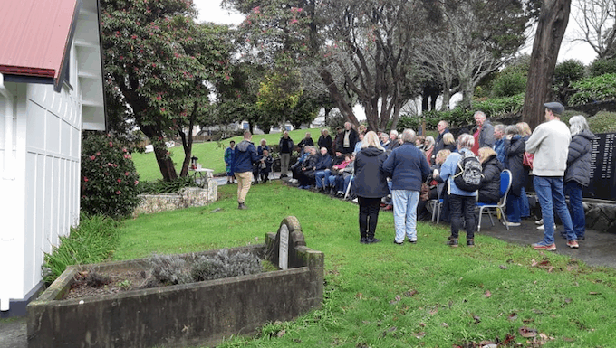 Porirua Cemetery manager Daniel Chrisp speaks at the Family Forum beside the chapel, as Mayor Anita Baker and whānau gather to honour 1800 patients buried in unmarked graves