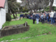 Porirua Cemetery manager Daniel Chrisp speaks at the Family Forum beside the chapel, as Mayor Anita Baker and whānau gather to honour 1800 patients buried in unmarked graves