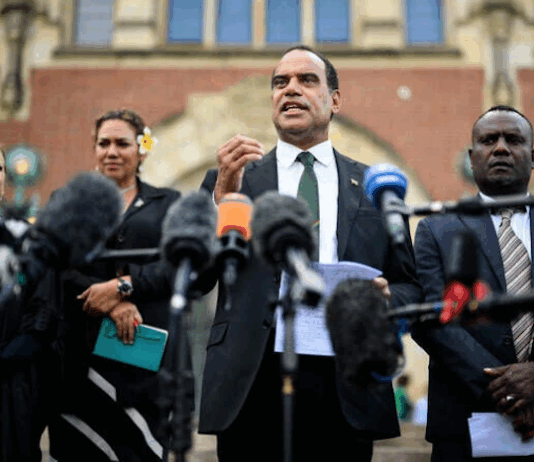 Vanuatu's Climate Minister Ralph Regenvanu talks to the media