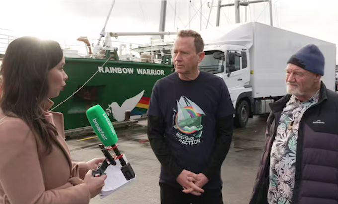 TVNZ reporter Corazon Miller talks to Greenpeace Aotearoa executive director Russel Norman and journalist David Robie after the Rainbow Warrior memorial dawn service today