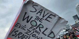 A "save the world" banner at last Saturday's pro-Palestinian march in Auckland's Viaduct precinct
