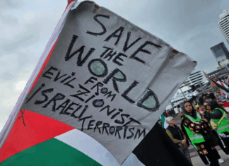 A "save the world" banner at last Saturday's pro-Palestinian march in Auckland's Viaduct precinct