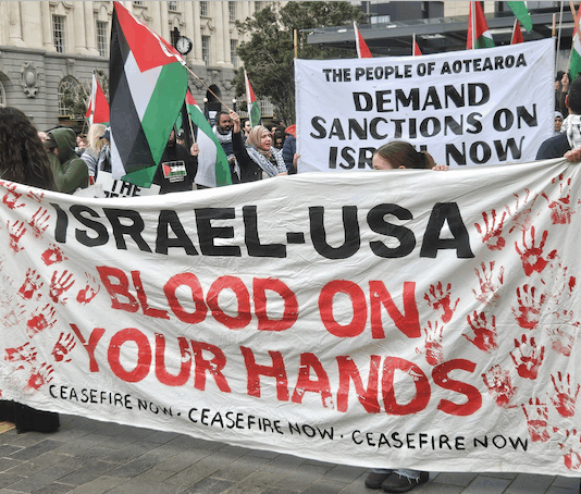 An "Israel-USA - blood on your hands" banner at a pro-Palestinian rally in Auckland last Saturday